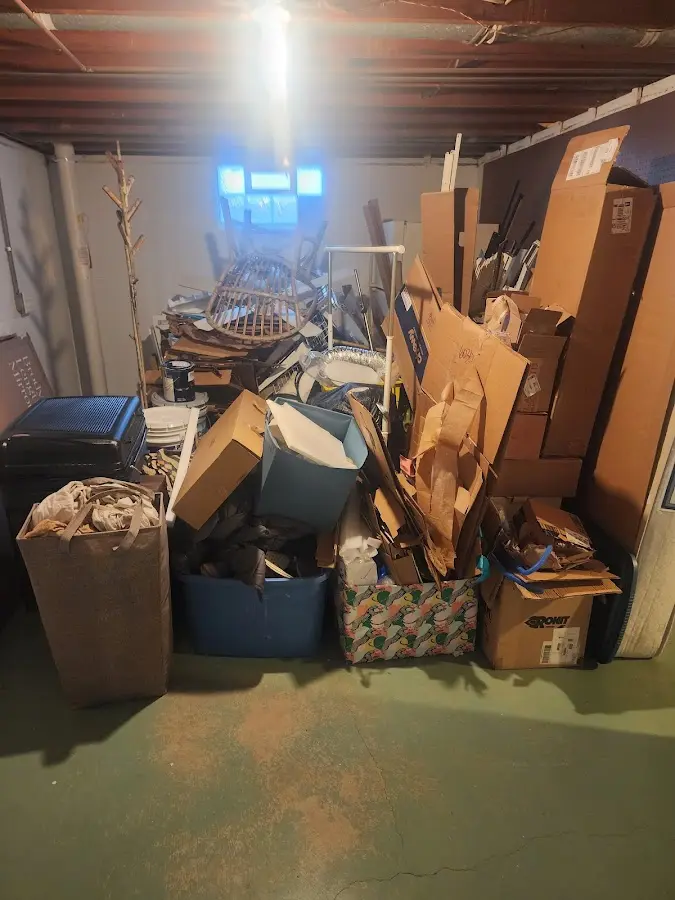 Roll-off dumpster container at job site for 2 Yard Dumpster Rental in West Brunswick